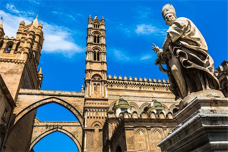 simsearch:841-05848661,k - Statue of Archbishop and arcades connecting main building to the palace at the Palermo Cathedral in historic Palermo in Sicily, Italy Stock Photo - Rights-Managed, Code: 700-08701923