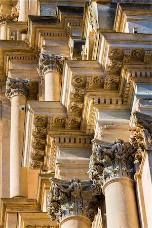 simsearch:700-08765303,k - Detail of layers of ornate mouldings and capitals of Corinthian pillars at the Cathedral of Saint George (Duomo di San Giorgio) in Ragusa in Sicily, Italy Stock Photo - Rights-Managed, Code: 700-08723105