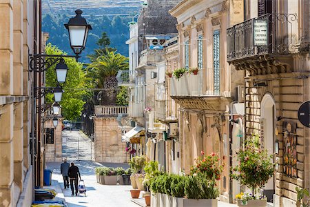 daily routine - Quiet, picturesque street lined with lanterns and old, stone buildings in Ragusa in Sicily, Italy Stock Photo - Rights-Managed, Code: 700-08723112