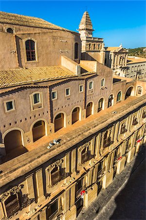 simsearch:700-08167347,k - Stone balconies and rooftops of historic buildings in the city of Noto in the Province of Syracuse in Sicily, Italy Stock Photo - Rights-Managed, Code: 700-08723156