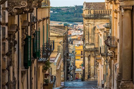 simsearch:700-08986676,k - Looking down through a street in the Old Town of Noto lined with stone buildings in the Province of Syracuse in Sicily, Italy Stock Photo - Rights-Managed, Code: 700-08723168