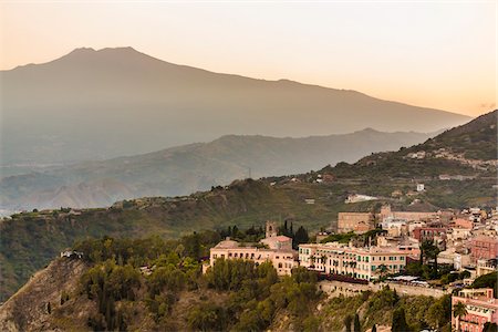 sicily skyline in italy - Overview of Taormina with Mount Etna in the background, Sicily, Italy Stock Photo - Rights-Managed, Code: 700-08723309