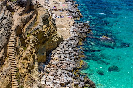 stone stairs - Stone staircase along the coastal cliffs at a resort in Santa Cesarea Terme in Puglia, Italy Stock Photo - Rights-Managed, Code: 700-08739610