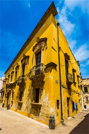 Medieval stone building with iron balconies in Gallipoli in Puglia, Italy Stock Photo - Rights-Managed, Code: 700-08739631