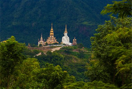 southeast asian (places and things) - Five Sitting Buddha statue at Wat Pha Sorn Kaew located in Khao Kho, Phetchabun in north-central Thailand. Stock Photo - Rights-Managed, Code: 700-08743687