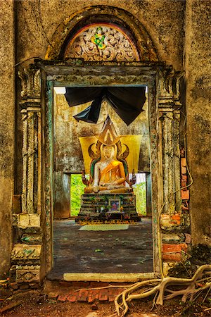 The ruins of the old Wat Wangwiwekaram (also called the Sunken Temple) at Sangkhlaburi in Kanchanaburi, Thailand. (The temple was submerged in the water due to the construction of a dam in 1984 but is visible when the water is low.) Stock Photo - Rights-Managed, Code: 700-08743693