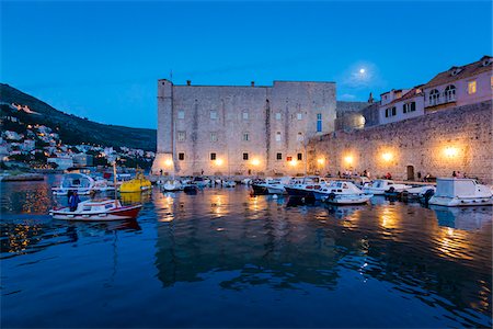 Boats in harbour at Dusk in Dubrovnik, Dalmatia, Croatia Stock Photo - Rights-Managed, Code: 700-08765331