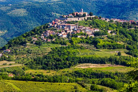 Fertile farmland in front of the medieval, hilltop town of Morovun in Istria, Croatia Stock Photo - Rights-Managed, Code: 700-08765502