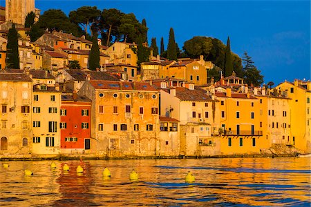 european destinations - Waterfront with the sun reflecting on the buildings of the fishing port city of Rovinj on the north Adriatic Sea in Istria, Croatia Photographie de stock - Rights-Managed, Code: 700-08765530