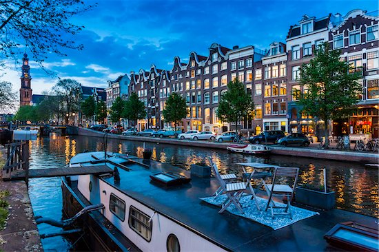 Table and chairs on top of a houseboat moored along the Prinsengracht canal at dusk in Amsterdam, Holland Stock Photo - Premium Rights-Managed, Artist: R. Ian Lloyd, Image code: 700-08973541