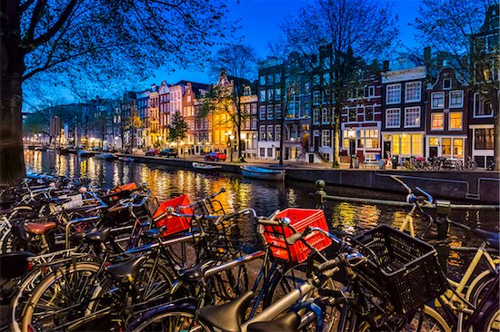 Typical buildings line the canal with a row of bicycles parked along the Herengracht in the evening in Amsterdam, Holland Stock Photo - Premium Rights-Managed, Artist: R. Ian Lloyd, Image code: 700-08973543
