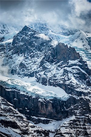 simsearch:700-03448755,k - Overview of snow covered mountains with clouds in the Jungfrau Region of the Bernese Oberland, Switzerland Stockbilder - Lizenzpflichtiges, Bildnummer: 700-08986149