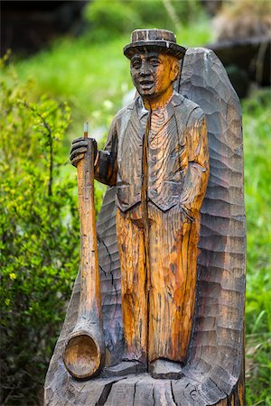 Close-up of a wooden statue of a mountaineer along a hiking trail near Zmutt at Zermatt in Switzerland Stock Photo - Rights-Managed, Code: 700-08986343