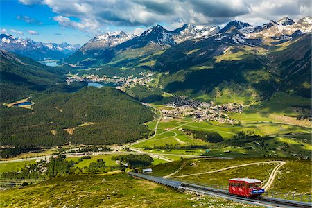 simsearch:400-05163750,k - Overview of the Engadin valley with the funicular railway from Punt Muragl up to the Muottas Muragl, near St Moritz, Switzerland. Stock Photo - Rights-Managed, Code: 700-08986407