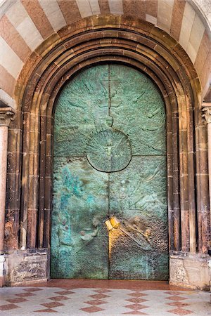 doorway to faith - Sacred spot on a copper door at the Assumption of Our Lady Cathedral in Bolzano, Italy Stock Photo - Rights-Managed, Code: 700-08986557