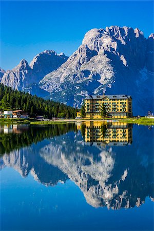 Grand Hotel Misurina reflected in Lake Misurina on a sunny day in the Dolomites in Veneto, Italy Stock Photo - Rights-Managed, Code: 700-08986622