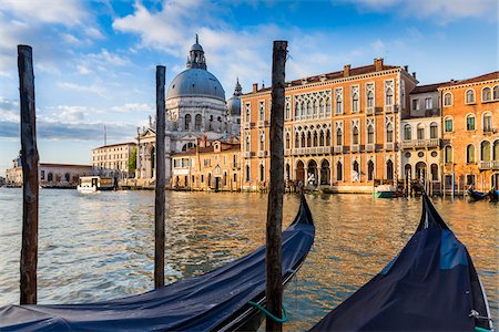 surface level - Gondola moored at a station along the Grand Canal with the dome of Santa Maria della Salute in the background in Venice, Italy Stock Photo - Rights-Managed, Code: 700-08986663