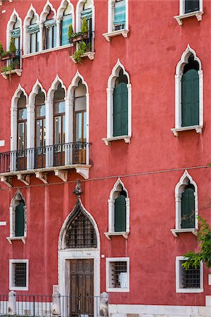 simsearch:600-06505795,k - Close-up facade of a tradtional stone building in red stucco with ornate window frames in Venice, Italy Stock Photo - Rights-Managed, Code: 700-08986700
