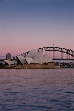 Sydney Opera House and the Sydney Harbour Bridge at sunrise in Sydney, Australia Photographie de stock - Rights-Managed, Code: 700-09022594