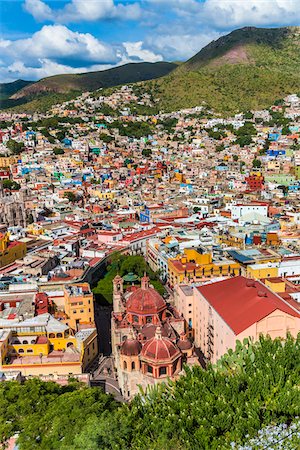 Scenic overview of Guanajuato City with the Templo de San Diego de Alcala church in the foreground and the multi-colored houses on the hills surrounding the city, Guanajuato State, Mexico Stock Photo - Rights-Managed, Code: 700-09071063