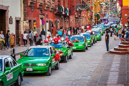 Taxi parade in the St Michael Archangel Festival in San Miguel de Allende, Mexico Stock Photo - Rights-Managed, Code: 700-09088039