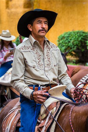 simsearch:700-09088035,k - Close-up portrait of a male, horesback rider parading to the Parroquia de San Miguel Arcangel at the St Michael Archangel Festival in San Miguel de Allende, Mexico Foto de stock - Con derechos protegidos, Código: 700-09088050