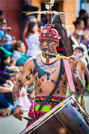 Close-up of a male, indigenous tribal dancer playing a drum in the St Michael Archangel Festival parade in San Miguel de Allende, Mexico Stock Photo - Rights-Managed, Code: 700-09088078