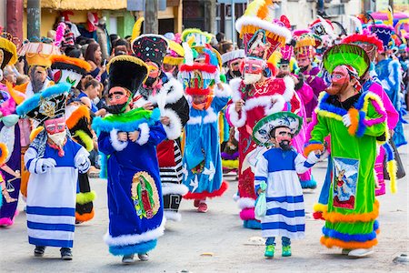 simsearch:610-03504714,k - People walking in the St Michael Archangel Festival parade in colorful costumes in San Miguel de Allende, Mexico Photographie de stock - Rights-Managed, Code: 700-09088085