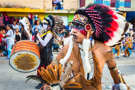 Indigenous tribal dancers wearing feathered headdresses in the St Michael Archangel Festival parade in San Miguel de Allende, Mexico Stock Photo - Rights-Managed, Code: 700-09088093