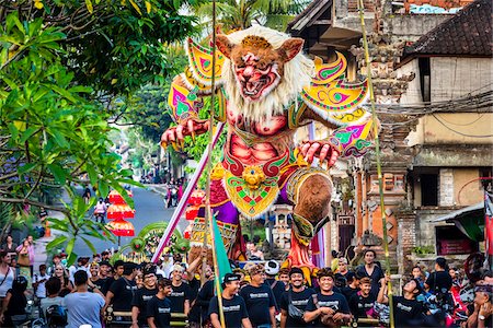 Procession of Balinese men with an Ogoh-ogoh statue in the Ngrupuk Parade on the eve of Nyepi Day in Ubud in Gianyar, Bali, Indonesia Stock Photo - Rights-Managed, Code: 700-09134721