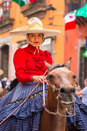 simsearch:700-02694233,k - Portrait of young woman on horseback in traditional dress in the Mexican Independence Day parade, San Miguel de Allende, Mexico. Stock Photo - Rights-Managed, Code: 700-09226956