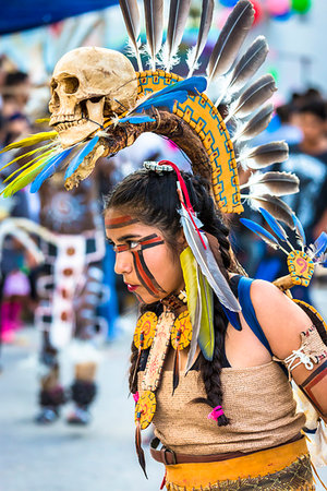 feathered headdress dancer - Close-up of female indigenous tribal dancer at a St Michael Archangel Festival parade in San Miguel de Allende, Mexico Stock Photo - Rights-Managed, Code: 700-09227124