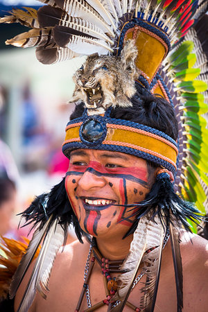 street festival mexico - Close-up of a male, indigenous tribal dancer with face paint and wearing headdress at a St Michael Archangel Festival parade in San Miguel de Allende, Mexico Stock Photo - Rights-Managed, Code: 700-09273238