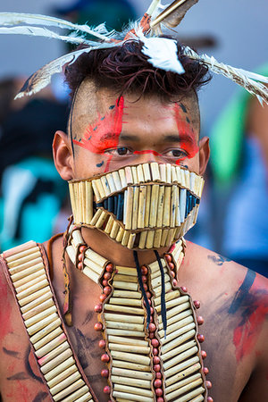 simsearch:700-09273241,k - Portrait of a male, indigenous tribal dancer wearing wooden beaded mask at a St Michael Archangel Festival parade in San Miguel de Allende, Mexico Fotografie stock - Rights-Managed, Codice: 700-09273257
