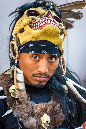 simsearch:700-09273241,k - Portrait of a male, indigenous tribal dancer with mask on his head looking at the camera at a St Michael Archangel Festival parade in San Miguel de Allende, Mexico Fotografie stock - Rights-Managed, Codice: 700-09273258