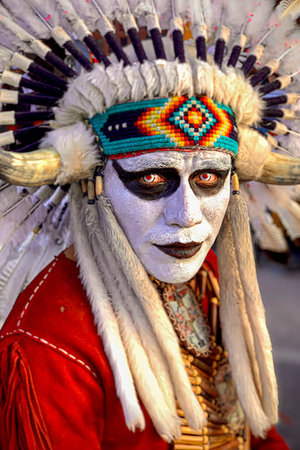 simsearch:700-09273241,k - Portrait of a male, indigenous tribal dancer wearing white face paint and red contact lenses at a St Michael Archangel Festival parade in San Miguel de Allende, Mexico Fotografie stock - Rights-Managed, Codice: 700-09273273