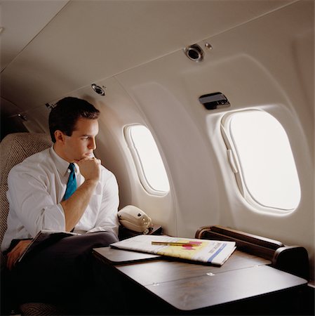 Businessman in Airplane Stock Photo - Rights-Managed, Code: 700-00007870