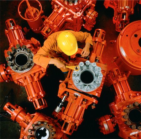 Man Working on Oil Field Equipment Stock Photo - Rights-Managed, Code: 700-00001858