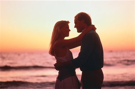 Silhouette of Couple Embracing on Beach at Sunset Santa Monica, California, USA Stock Photo - Rights-Managed, Code: 700-00002653