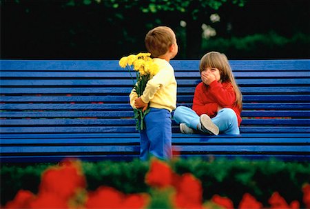 Boy Giving Girl Flowers Foto de stock - Con derechos protegidos, Código: 700-00003981