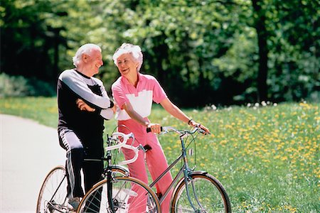 Mature Couple on Bicycles Foto de stock - Con derechos protegidos, Código: 700-00014604