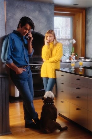 dogs and woman in kitchen - Couple Using Cordless Telephone In Kitchen Stock Photo - Rights-Managed, Code: 700-00015243