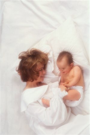simsearch:700-00075000,k - Overhead View of Mother and Baby On Bed Stock Photo - Rights-Managed, Code: 700-00015260
