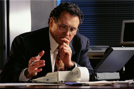 simsearch:400-07931035,k - Businessman with Adding Machine And Laptop Computer Stock Photo - Rights-Managed, Code: 700-00017358