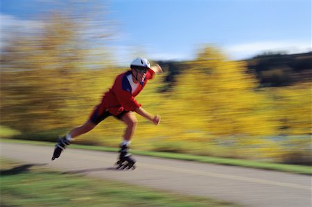 Man In-Line Skating Outdoors in Autumn Stock Photo - Rights-Managed, Code: 700-00017517