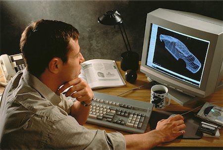 engineer at desk - Man Using Computer Foto de stock - Con derechos protegidos, Código: 700-00017545