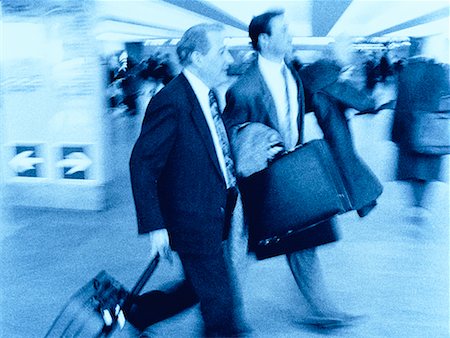 simsearch:700-01345230,k - Businessmen Walking in Airport Stock Photo - Rights-Managed, Code: 700-00017547