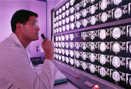 Male Doctor Examining MRI Images Stock Photo - Rights-Managed, Code: 700-00017650