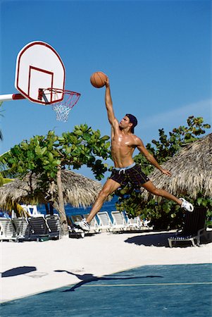 Man Playing Basketball by Tropical Beach Stock Photo - Rights-Managed, Code: 700-00017837