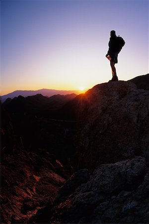 Silhouette de la personne randonnée au coucher du soleil, la forêt nationale de Coronado Tuscon, Arizona, Etats-Unis Photographie de stock - Rights-Managed, Code: 700-00017957